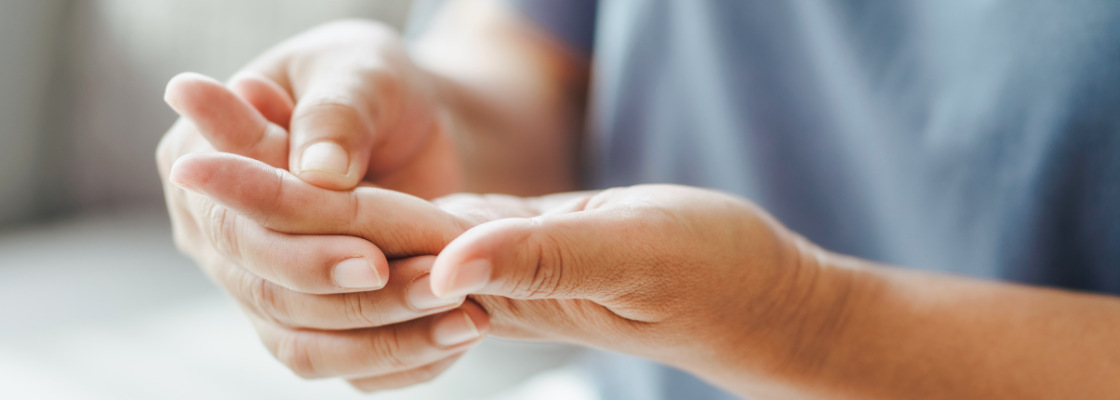 Holding the index finger from the opposite hand, due to pain from arthritis joint pain