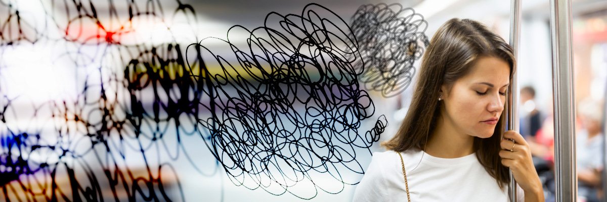 Woman standing on train with scribbles representing anxiety